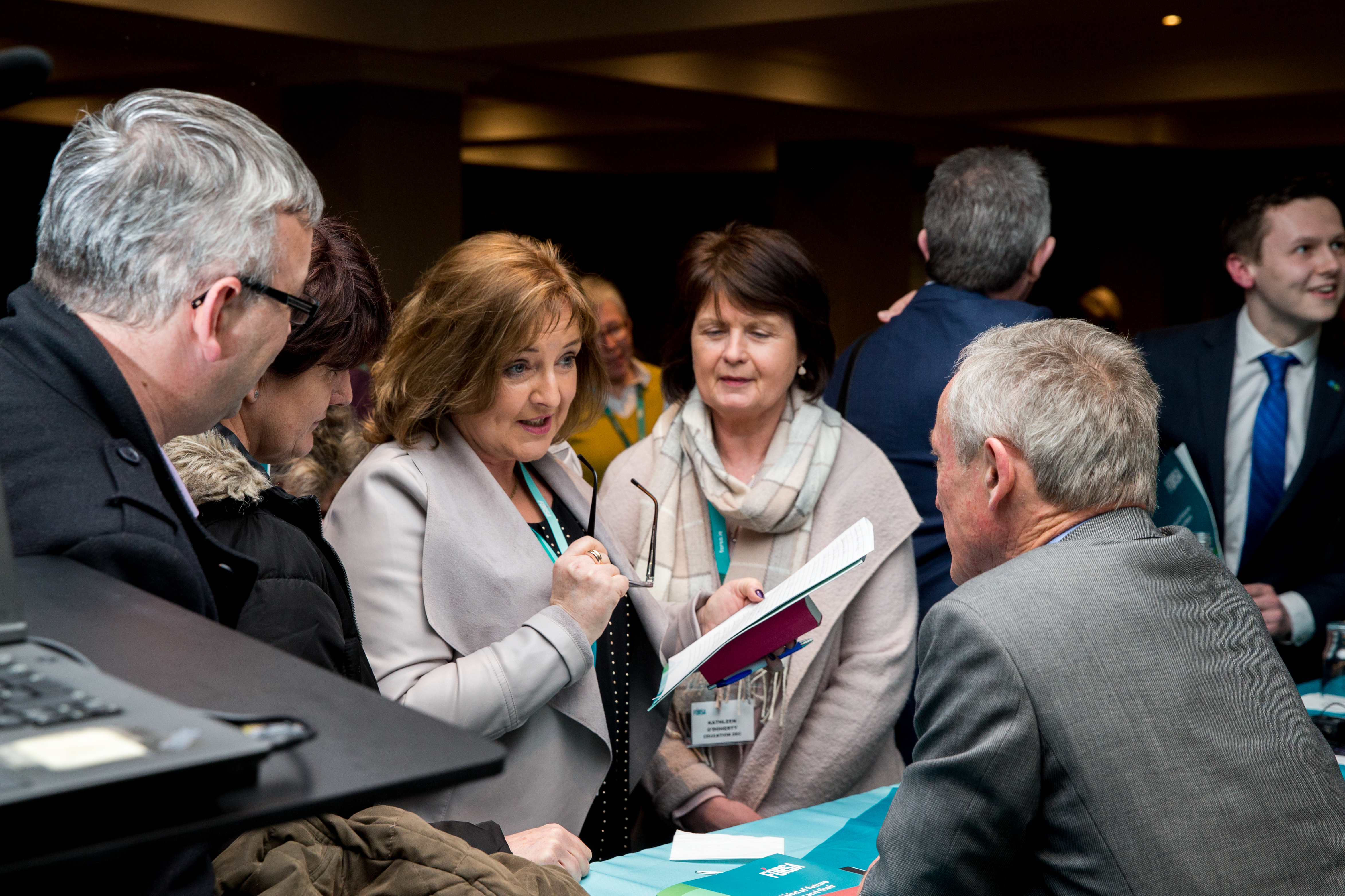 Delegates speaking with Minister Bruton at last year's Education seminar.