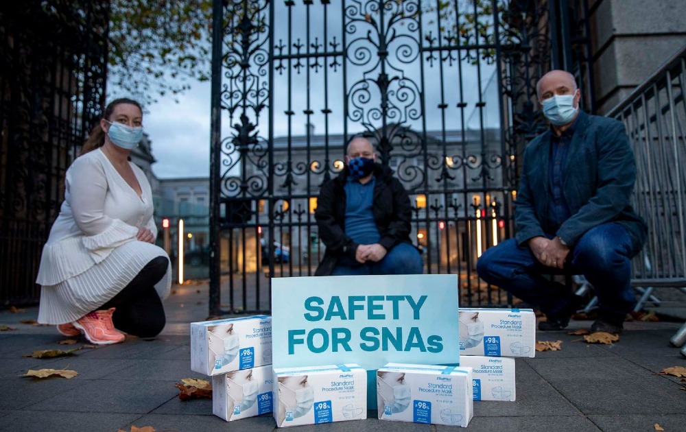 L-R: Jesslyn Henry, Shane Lambert and Dermot Daly, pictured yesterday at Leinster House as the union made preparations to distribute medical grade face masks to SNAs who have not been provided with suitable face covering by their employers.