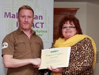 David Hall of IMPACT’s Dublin North HSE branch receives his training certificate.