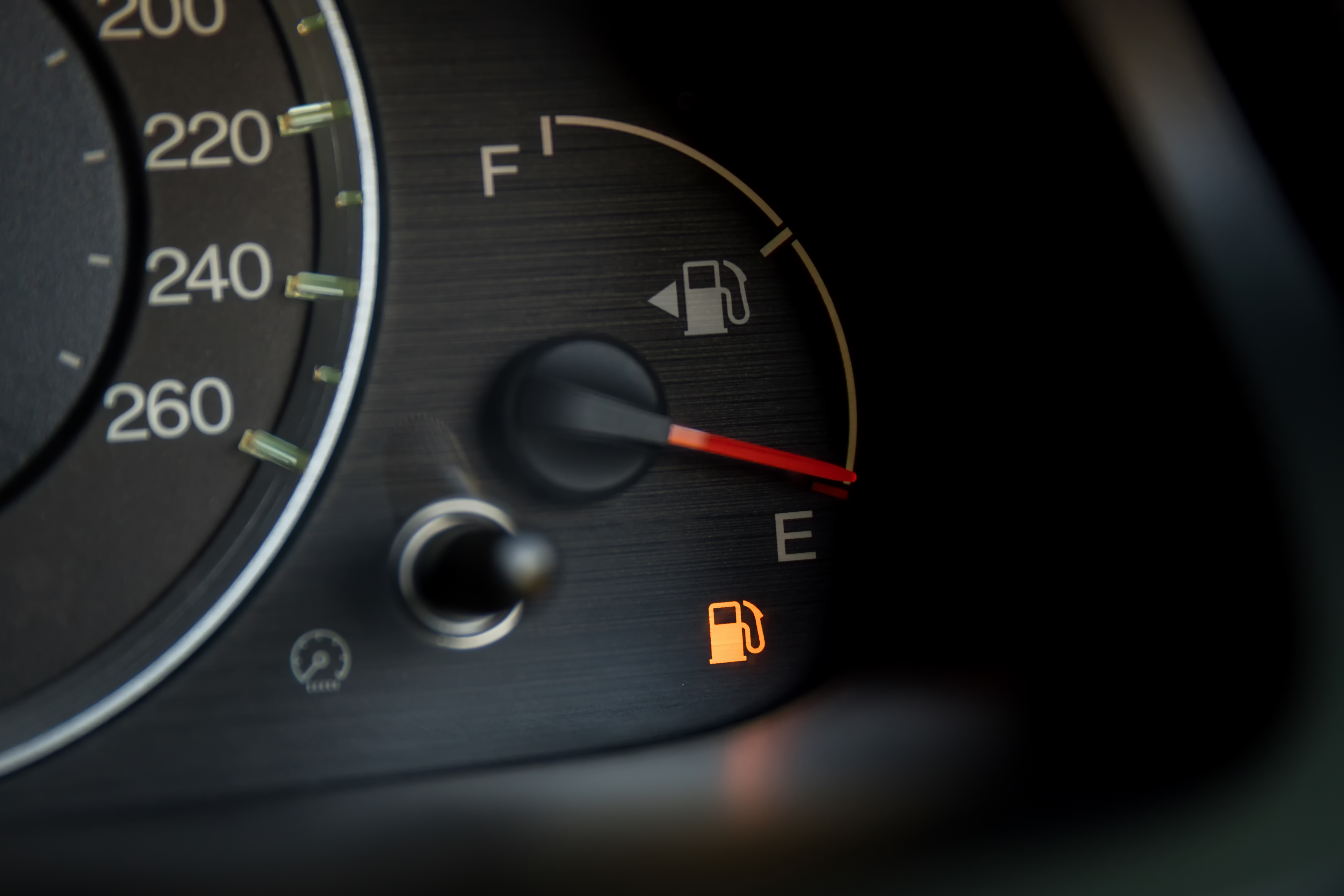 Source: shutterstock subscription. Photograph of fuel gauge on car dashboard showing empty.