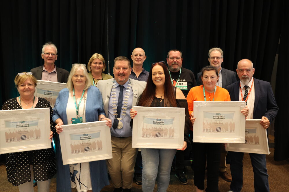 Photo of distinguished service awards winners with Fórsa President Martin Walsh