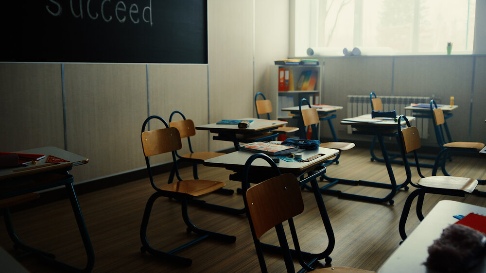 Source: Fórsa. Image of dimly lit empty primary school classroom.